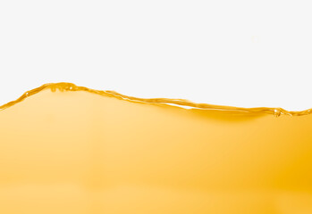 Vegetable oil surface, bubbles against white background.