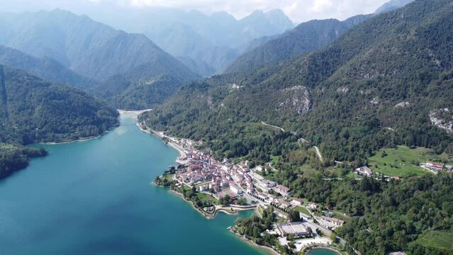 Scenic aerial footage of Barcis, Italy. Fascinating aerial views of Barcis Village, Lake Barcis and Dolomites mountains (Alps).