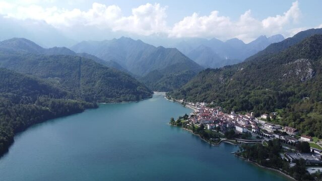 Scenic aerial footage of Barcis, Italy. Fascinating aerial views of Barcis Village, Lake Barcis and Dolomites mountains (Alps).