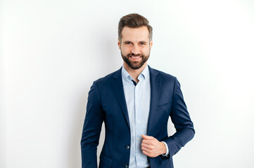 Portrait of a proud confident handsome bearded caucasian businessman, successful ceo, in formal...