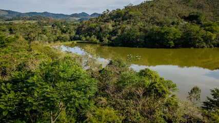 Obraz premium The exuberant Atlantic Forest within the protected area of the Guapiaçu Ecological Reserve, in the metropolitan region of Rio de Janeiro.