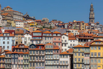Fototapeta na wymiar Summer cityscape, Narrow cobbled streets and houses in Porto, A coastal city in northwest Portugal known for its stately bridges and port wine production in the medieval Ribeira (riverside) district.