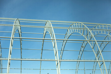 Basis for warehouse. Metal beams. Details of construction of sports complex.