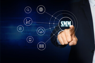 Social media marketing concept. Man touching virtual icon SMM on dark background, closeup