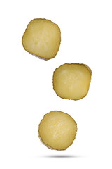 Slices of tasty pickled cucumbers falling on white background