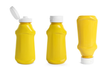 Set with spicy mustard in plastic bottles on white background