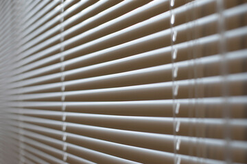 Blinds in office. Interior details. Window is closed from light. Protection from spicy sunlight.