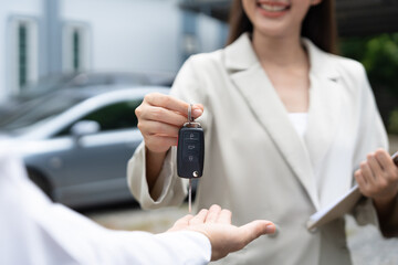 lease and rental car. Dealership manager send car keys to the new owner.  Sales, loan credit financial, rent vehicle, insurance,  renting, Seller, dealer, installment, car care business