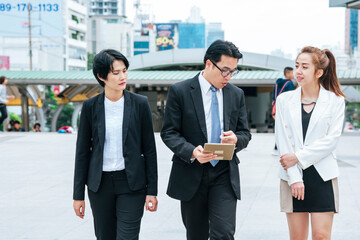 Business Woman Partner talk, meeting team Partnership in modern city together. Diversity Asian Business Partner online meeting trust teamwork. Asian Two Business people teams meeting outdoor in city.