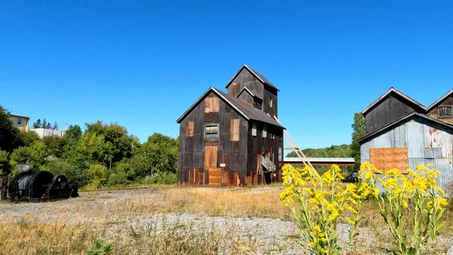 Old head frame of boarded up silver mine facilities along the Heritage Silver Trail, a National Historic Site of Canada, in Cobalt, Ontario