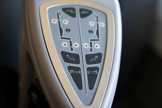 Close Up On A Commercial Airplane First Class Seat Control Panel.