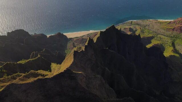 Drone view above sharp edge ridge of the cliffs in Kalalau Valley at Na Pali coast, Kauai. Kokee state park