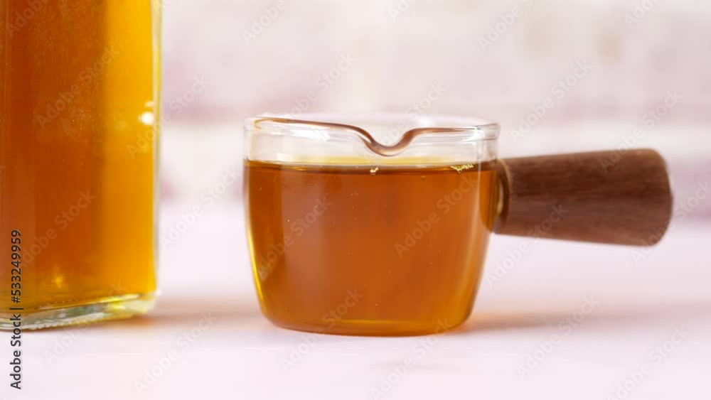 Sticker Mustard oil in a jar on table 