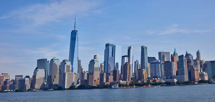 Panorama of New York City skyline from the water on a beautiful sunny day