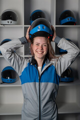 Caucasian woman puts on a helmet before flying in a wind tunnel. Free fall simulator.