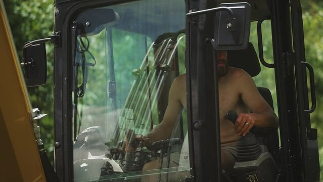 Man Operating Excavator working construction (4k 30p Slow Motion)