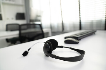 Close up image of headphones for competent online working. Customer service operator equipments.