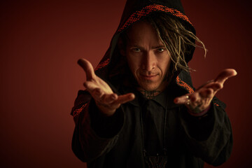 mysterious shaman in cloak