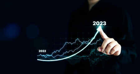 Businessman pointing arrow graph corporate future growth plan. Business development to success and...