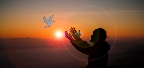 Concept of worship in Christianity. Doves fly into man hands. Christians have faith in Holy Spirit....