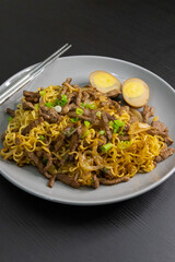 Indonesian Mi Goreng Stir Fried Noodles with Soy Sauce Egg, Scallions, and Meat