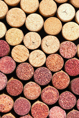 Obraz na płótnie Canvas Collection of wine cork from white and red wine, natural texture bottle stoppers top view, colorful background from closeup wooden corks. Natural textured stoppers Winery, winemaking concept