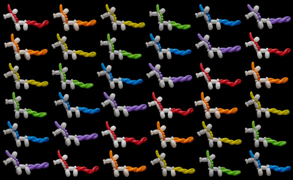 Rectangular pattern of rainbow unicorns on black