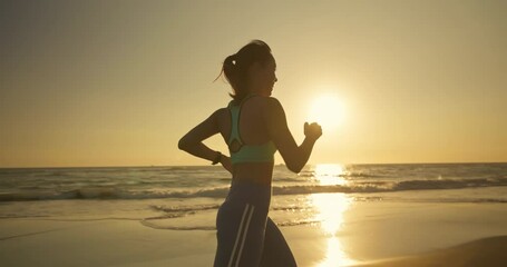 sport woman running on beach - Powered by Adobe