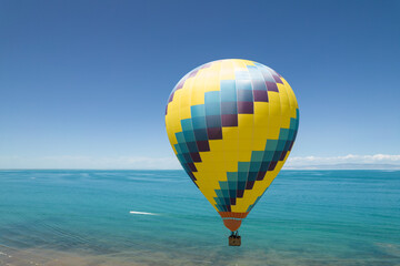 Fire Balloon. Hot air balloon flying over sea.
