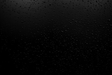 Water droplets on the floor with black background