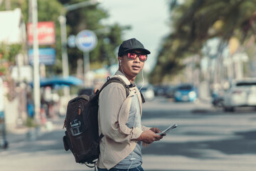 Tourists hold maps to find attractions, restaurants or hotels. backpacker and travel concept.