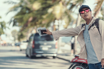 Tourists hold maps and hitchhiking. backpacker and travel concept.