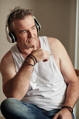 Mature Man Listening to Music