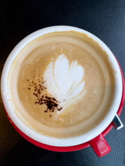 Red cup of hot coffee.