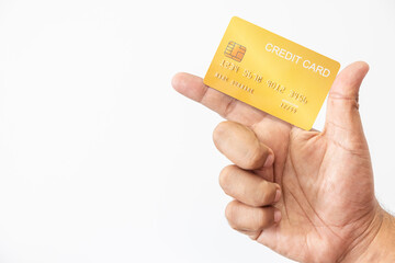 Close-up hand of Asian man holding yellow gold credit card in his hand. isolated on white background. Concept of finance, trading, communication, social, technology, business