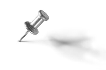 silver color push pin on a white background