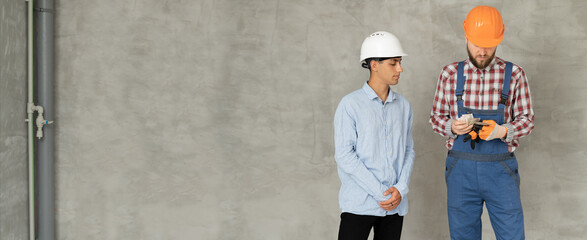 Arabic man pays for the work of foreman builder repairman with dollar money. Construction worker...