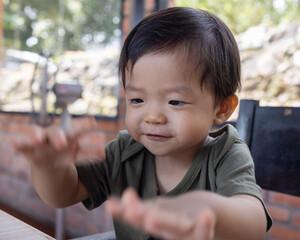 Happy 1-2 years old child enjoying his lunch