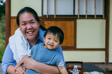 Portrait image of Asian Chinese mother with Happy 1-2 years kids during holiday at Kundasang Town,...