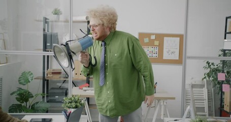 Funny evil guy mean boss is yelling at scared subordinates using megaphone in office. Corporate relationship and negative emotions concept. - Powered by Adobe