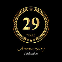29th anniversary logo with golden laurel wreaths, gold crown, and gold star isolated on black background. Premium design for happy birthday, weddings, greetings card, poster, graduation, ceremony.