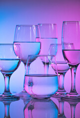 Wine glasses with neon multicolor light