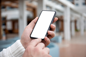 male hands hold phone with isolated screen background of office