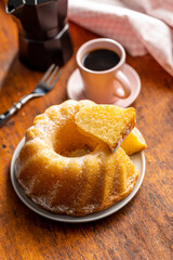 Sweet sponge cake. Bundt cake on wooden table.