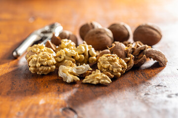 Peeled walnut on wooden table.