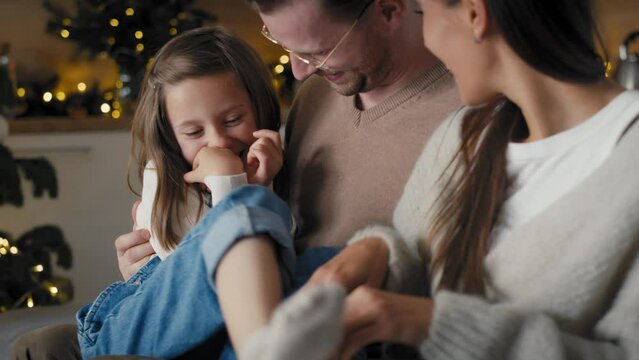 Caucasian family spending time together at home in Christmas time. Shot with RED helium camera in 8K. 