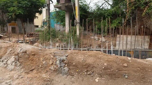 View of under construction site with trees in background