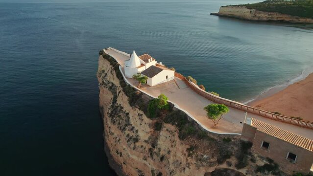 Aerial view of the church Senhora de Nossa, Algarve region at sunrise, Portugal