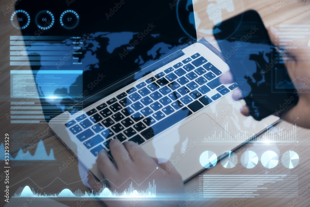 Aufkleber businessman hand using laptop keyboard and smartphone with abstract map and business chart hologram 
