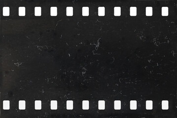 Strip of old celluloid film with dust and scratches - 533294537